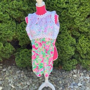 Lilly Pultizer Size 4 Romper. White trimming with pink and green accents!